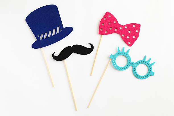 Photo booth colorful props for party Photo booth colorful props for party - glasses, mustache, hat, ribbon on white background sewing item photos stock pictures, royalty-free photos & images