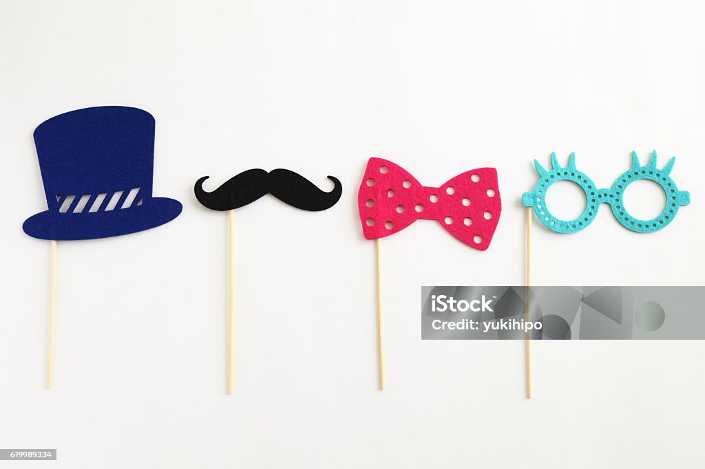 Photo booth colorful props for party Photo booth colorful props for party - glasses, mustache, hat, ribbon on white background Mustache Stock Photo