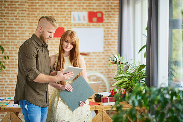 istock Shot of two colleagues discussing ideas 619992690