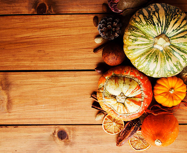 istock Seasonal wooden table setting with small pumpkins 619992876
