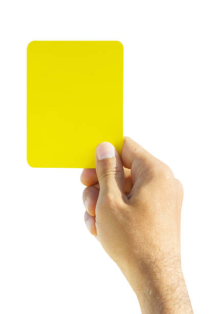 istock Hand of soccer referee showing yellow card 619992878