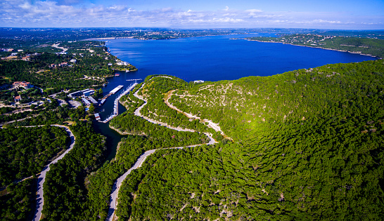 Lake Travis Panoramic View Above Texas Hill Country overlooking the Colorado River near the Mansfield Dam outside of Austin , Texas. Nice Summer day outside with relaxation blue water 