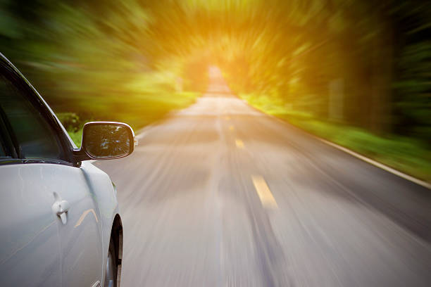 istock Driving on a road  with heavy blurred motion. 619999104