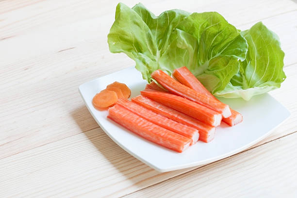 istock Kanikama, Crab stick with green vegetable 619999548