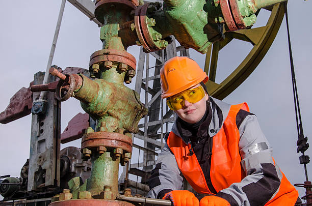 istock Woman engineer in the oilfield 620000904