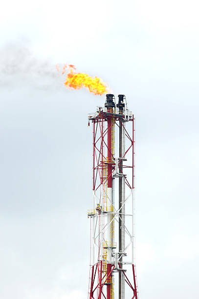 istock the refinery flare with cloud in background 620001332