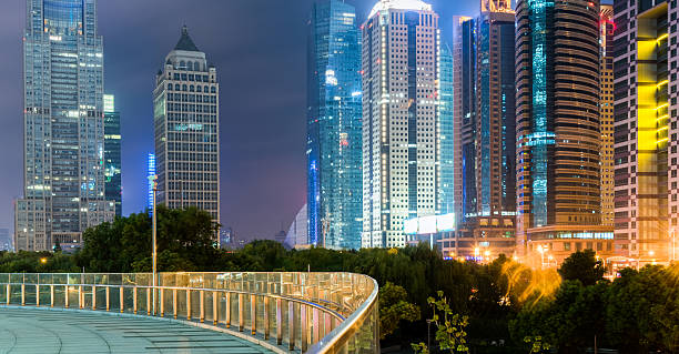 istock footbridge with cityscape at night 620002604