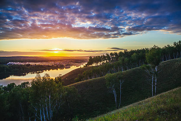 istock Sunset over the village and forest 620002660
