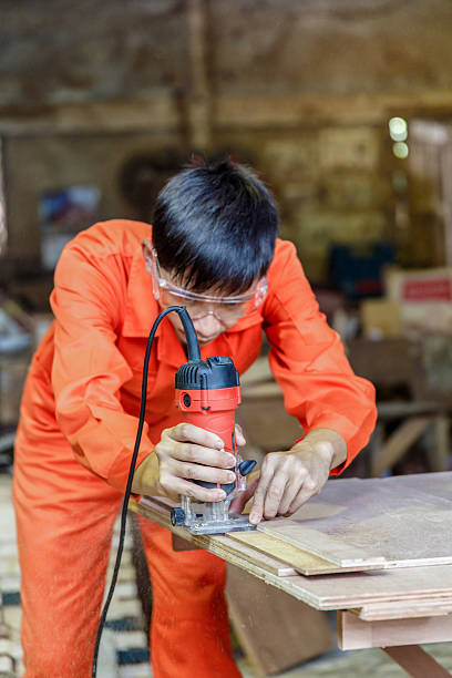 asian young attractive man doing woodwork in carpentry - xian audio imagens e fotografias de stock