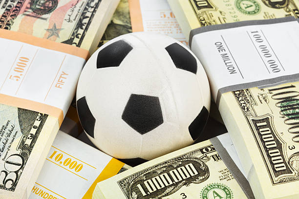 istock Money and soccer ball 620004176