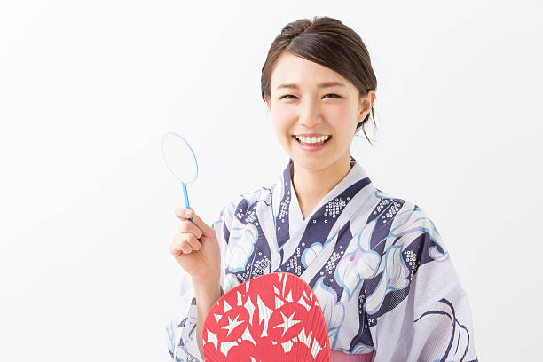 istock Woman wearing a kimono holding a paper net 620004690