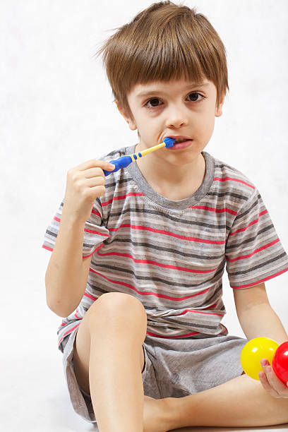 istock Boy takes care of his teeth 620004872