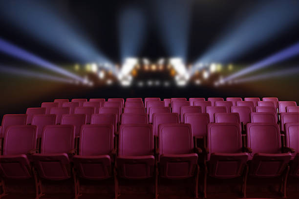 istock Empty theater auditorium or cinema with red seats 620005176