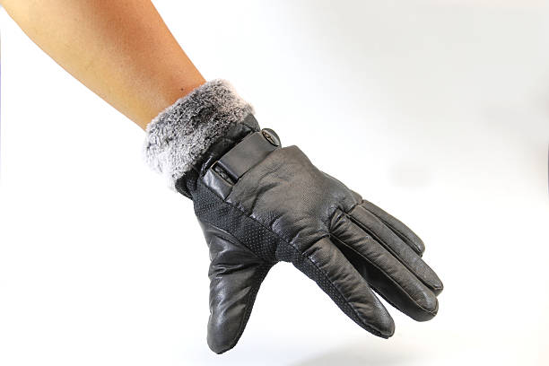 istock Men wearing winter gloves, black on white background. 620008138