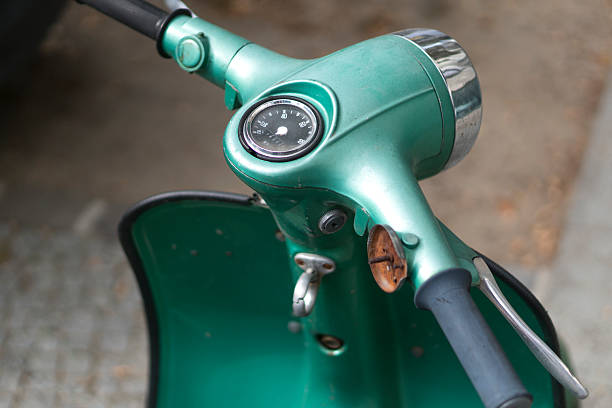 Berlin, Germany - September 26, 2016: view from above of green Italian vespa motorcycle. Vespa is an Italian brand of scooter manufactured by Piaggio of Pontedera. The name means wasp in Italian