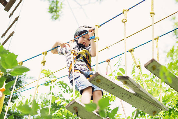 istock Kids climbing in adventure park. 620366964