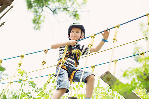 istock Kids climbing in adventure park. 620367008