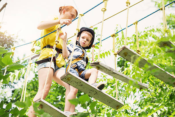 istock Kids climbing in adventure park. 620367136