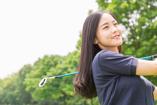 istock Japanese woman playing golf 620367222