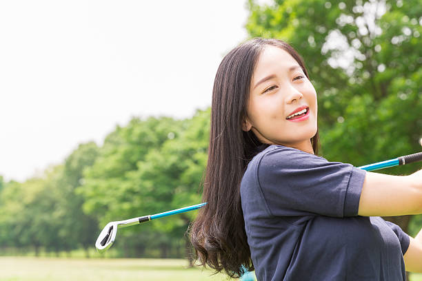 istock Japanese woman playing golf 620367276