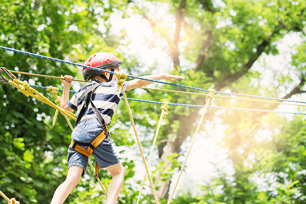 istock Kids climbing in adventure park. 620368766