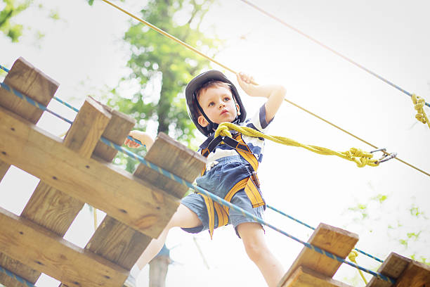 istock Kids climbing in adventure park. 620369536