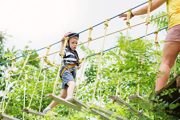 istock Kids climbing in adventure park. 620369610