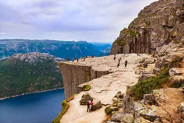 Preachers Pulpit Rock in fjord Lysefjord - Norway Preachers Pulpit Rock in fjord Lysefjord - Norway - nature and travel background norway lysefjorden fjord norwegian currency stock pictures, royalty-free photos & images