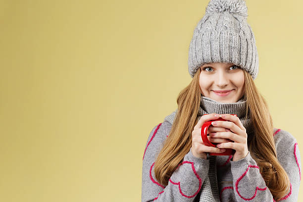 istock girl wearing gray woolen cap and scarf 620372628