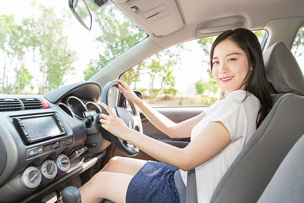 istock Japanese woman driving a car 620373896