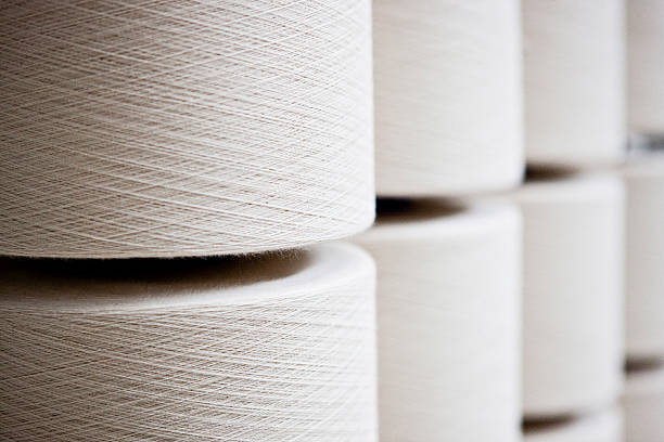 Textile thread spools Textile thread spools white color. textile industry textile thread industry stock pictures, royalty-free photos & images