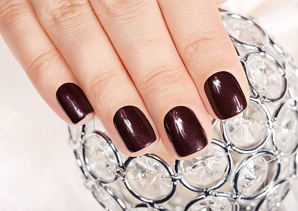 istock Hands with beautiful short manicured nails 620377198