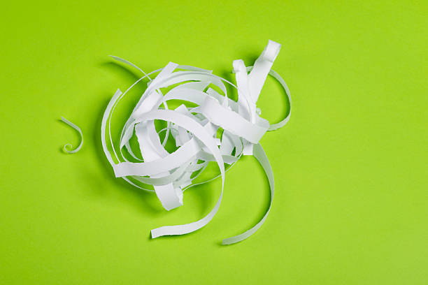 istock Pieces of torn paper over the green background 620377232