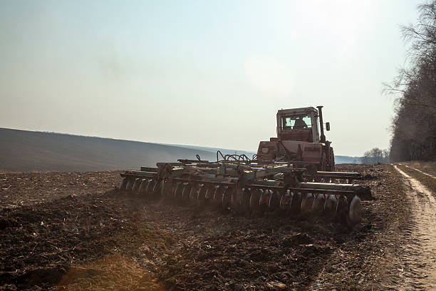 istock Harrowing the soil with disc harrows 620377616