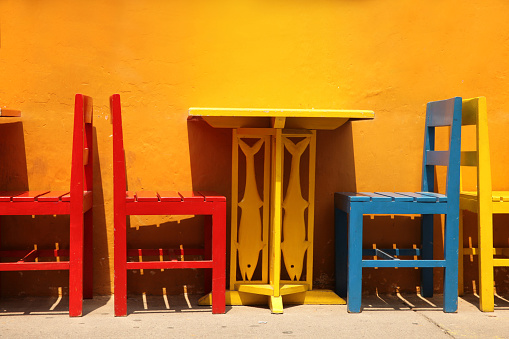 Colourful table & chairs ready for a street cafe or restaurant, Cartagena, Colombia.