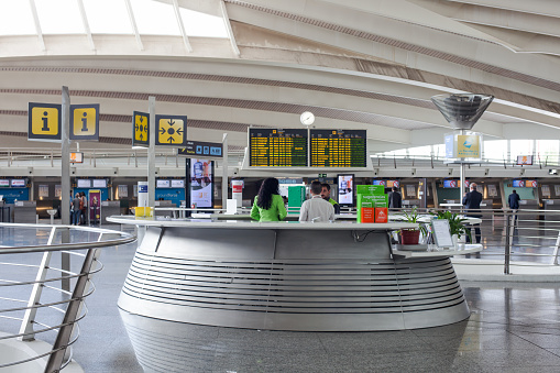 Bilbao, Basque Country, Spain – September 22, 2016: Bilbao Airport is located about 10 km north from Bilbao, in the municipality of Loiu, in Biscay. Departure lounge in Bilbao Airport, information point