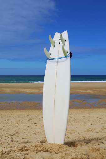 Surfboard isolated on beach