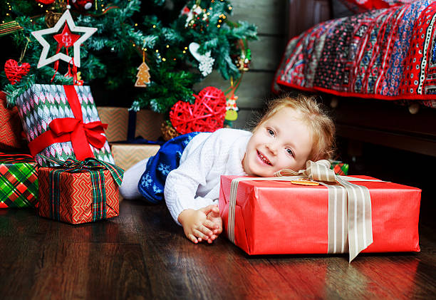 istock girl with presents 620381542