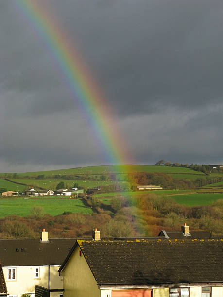 istock Rainbow above countryside in England 620381594