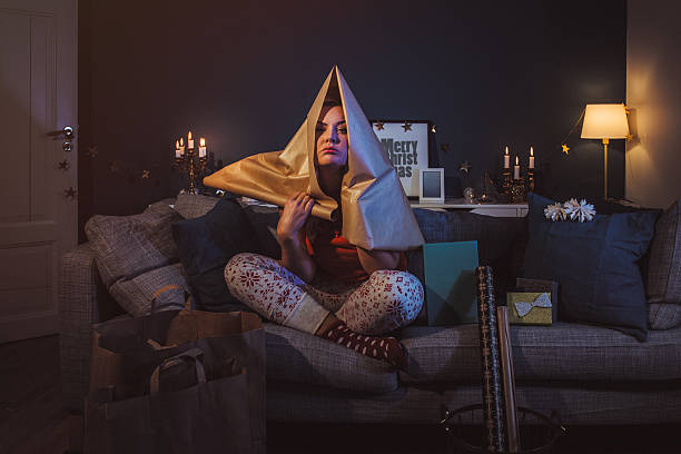 upset woman at home with christmas gifts - compressed imagens e fotografias de stock