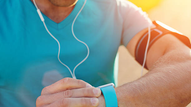 istock Athlete looking at his smart watch on the wrist 620382052