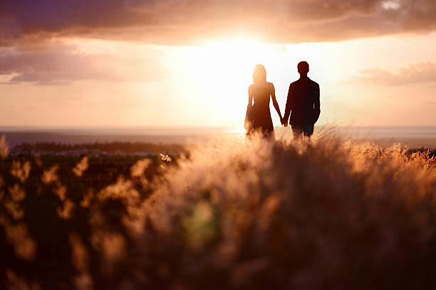 istock Young couple enjoying the sunset 620384226