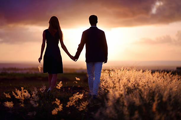 istock Young couple enjoying the sunset 620384312