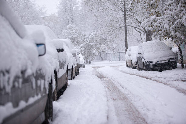 istock Parked cars covered with snow - snow storm 620385454