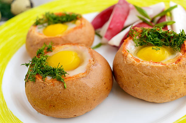 istock Baked small flavorful bun with bacon, cheese, quail egg 620385690