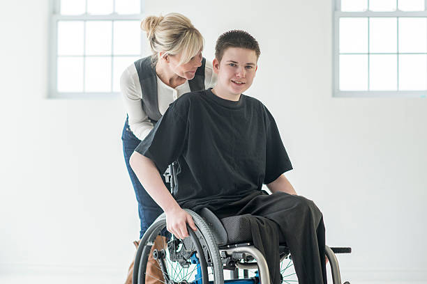 istock Caregiver for a Teenager with a Physical Disability 620385700