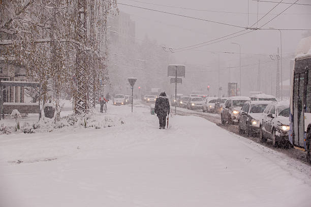 istock Winter background - snowstorm in city 620387362