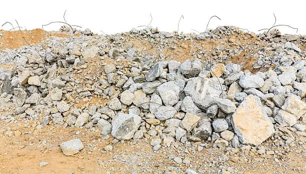 pieces of concrete and brick rubble debris on construction site isolated on white background