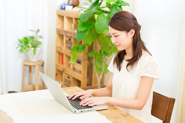 istock Japanese woman using a laptop 620390888