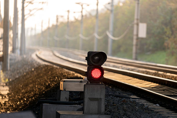 istock red signal light and railway track 620391884